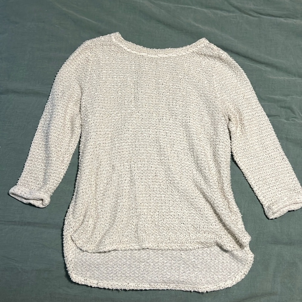 Cream colored sweater with black specks